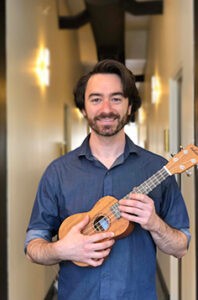 Expert ukulele instructor showcasing the best ukulele for beginners in a comprehensive guide on choosing the perfect first instrument